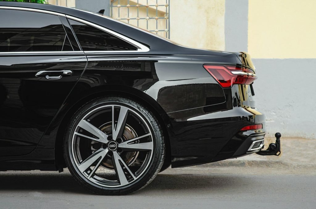 a black car parked in front of a building
